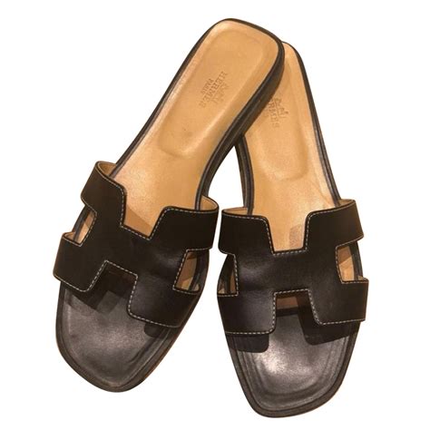 black hermes oran sandals